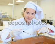 Chef working on vat of chocolate