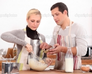 Couple making a cake together