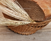 rye bread and ears of corn in basket